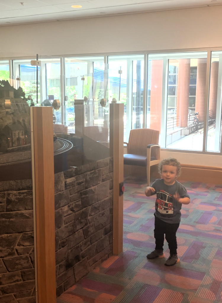 Christian enjoys a donor-funded train display at UPMC Children’s.